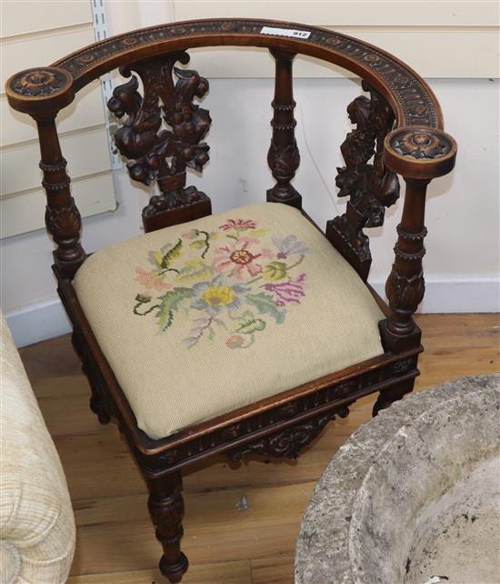 An early 20th century carved walnut corner chair